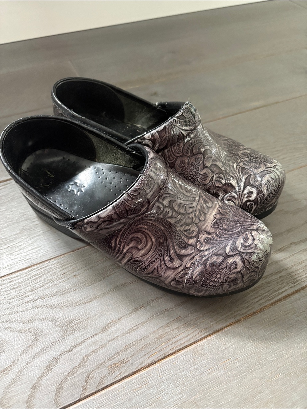 Dansko Black and Gray Floral Embossed Clogs